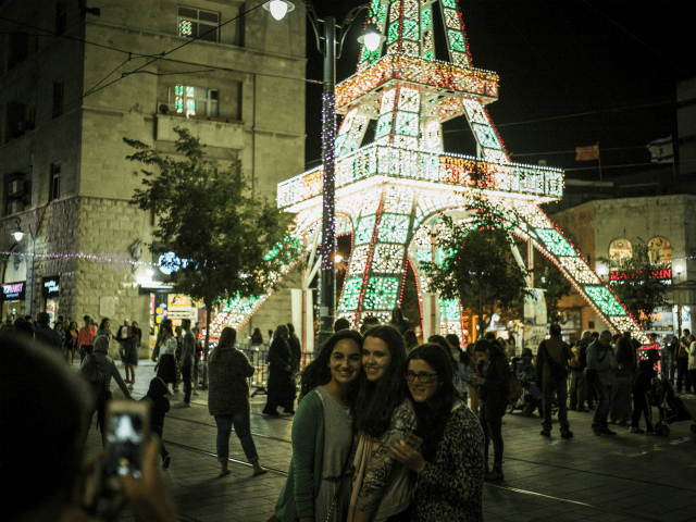 People take photographs near the Light Festival on May 26, 2016 in Jerusalem, Israel. The