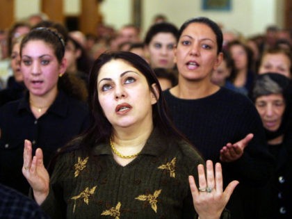 Iraqi Christians pray in a church, as all Christian denominations in Iraq prayed to prevent war on Iraq November 22, 2002 in Baghdad, Iraq. NATO members have declared themselves united in backing U.N. efforts to rid Iraq of weapons of mass destruction, but the 19-nation defense alliance stopped short of …