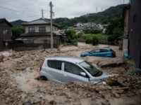 Japan-flooding-afp A picture shows cars trapped in the mud after floods in Saka, Hiroshima prefecture on July 8, 2018. - Japan's Prime Minister Shinzo Abe warned on July 8 of a 'race against time' to rescue flood victims as authorities issued new alerts over record rains that have killed at least …
