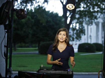 CNN White House correspondent Kaitlan Collins talks during a live shot in front of the White House, Wednesday, July 25, 2018, in Washington. Collins says the White House denied her access to President Donald Trump's Rose Garden statement with the European Union Commission president because officials found her earlier questions …