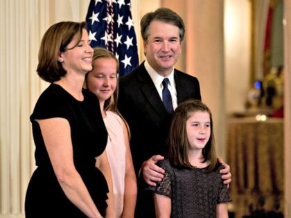 Brett Kavanaugh, appeals court judge, stands after being nominated as an associate justice of the U.S. Supreme Court by U.S. President Donald Trump, not pictured, with his wife Ashley Estes Kavanaugh, left, and daughters Margaret, second left, and Liza during a ceremony in the East Room of the White House …