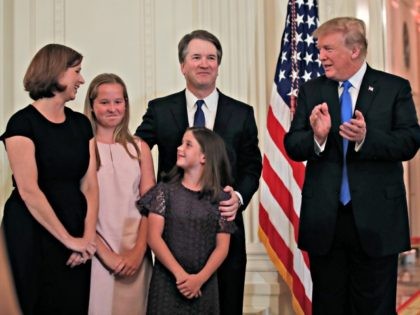 President Donald Trump talks with Judge Brett Kavanaugh his Supreme Court nominee, and his