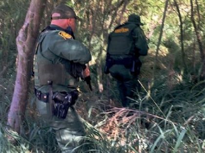Laredo Sector Border Patrol agents move to rescue migrant who was being drowned in the Rio Grande River by an armed group from Mexico. (Photo: U.S. Border Patrol/Laredo Sector)