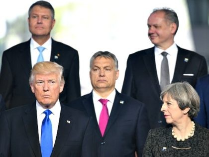 Leaders Meet For NATO Summit BRUSSELS, BELGIUM - MAY 25: US President Donald Trump (front left) and Prime Minister Theresa May (front right) during the North Atlantic Treaty Organisation (NATO) summit on May 25, 2017 in Brussels, Belgium.