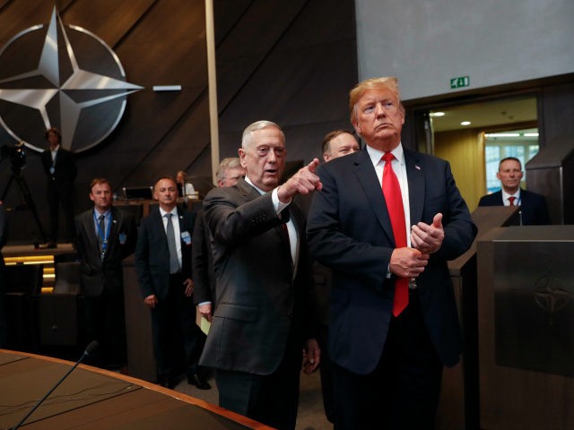 U.S. President Donald Trump, right, walks in with Defense Secretary Jim Mattis, left, as they arrive to attend the multilateral meeting of the North Atlantic Council, Wednesday, July 11, 2018 in Brussels, Belgium. (AP Photo/Pablo Martinez Monsivais/pool)
