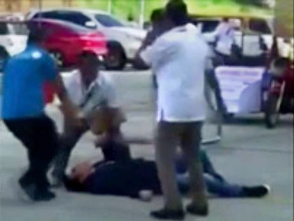 In this image made from video, Philippines Mayor Antonio Halili is seen on the ground after being shot during a flag-raising ceremony, Monday, July 2, 2018, in Tanauan city, south of Manila, Philippines. Mayor Halili known for parading drug suspects in public but also alleged to have drug ties himself …