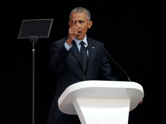Former U.S. President Barack Obama, left, delivers his speech at the 16th Annual Nelson Mandela Lecture at the Wanderers Stadium in Johannesburg, South Africa, Tuesday, July 17, 2018. In his highest-profile speech since leaving office, Obama urged people around the world to respect human rights and other values under threat …