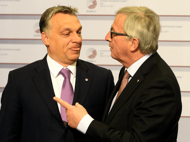 Hungarian Prime Minister Viktor Orban is greeted by President of the European Commission J