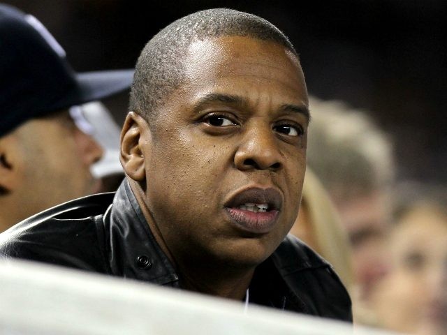 Entertainment mogul Jay-Z watches the New York Yankees play against the Texas Rangers in Game Three of the ALCS during the 2010 MLB Playoffs at Yankee Stadium on October 18, 2010 in New York, New York. (Photo by Nick Laham/Getty Images)