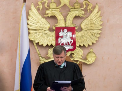 Russia's Supreme Court judge Yuri Ivanenko reads the decision in a court room in Moscow, Russia, on Thursday, April 20, 2017. Russia's Supreme Court has banned the Jehovah's Witnesses from operating in the country, accepting a request from the justice ministry that the religious organisation be considered an extremist group, …