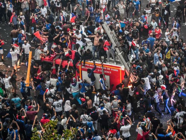 This picture taken from the terrace of the Publicis drugstore on July 15, 2018 shows peopl