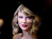 TaylorSwiftcop1 LAS VEGAS, NV - SEPTEMBER 19: Recording artist Taylor Swift attends the 2014 iHeartRadio Music Festival at the MGM Grand Garden on September 19, 2014 in Las Vegas, Nevada. (Photo by Isaac Brekken/Getty Images for iHeartMedia)