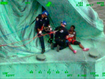 In this July 4, 2018, frame from video provided by the New York City Police Department, members of the NYPD Emergency Service Unit work to safely remove Therese Okoumou, a protester who climbed onto the Statue of Liberty and was charged with misdemeanor trespassing and disorderly conduct. Okoumou told police …