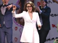 TinaFey1 Jeff Richmond, left, and Tina Fey participate in the curtain call for the "Mean Girls" opening night on Broadway at the August Wilson Theatre on Sunday, April 8, 2018, in New York. (Photo by Greg Allen/Invision/AP)