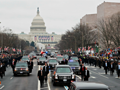 With Capitol Hill in the background, President Donald Trump and the first family ride in a motorcade during the inaugural parade in Washington, Friday, Jan. 20, 2017, after Donald Trump was sworn in as the 45th president of the United States.