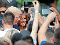 Trump July Fourth President Donald Trump, accompanied by first lady Melania Trump, greets military families during an afternoon picnic on the South Lawn of the White House, Wednesday, July 4, 2018, in Washington.