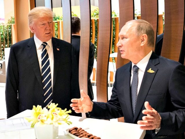 HAMBURG, GERMANY - JULY 07: In this photo provided by the German Government Press Office (BPA), Donald Trump, President of the USA (C) meets Vladimir Putin, President of Russia during the G20 Summit on July 7, 2017 in Hamburg, Germany. The G20 group of nations are meeting July 7-8 and …