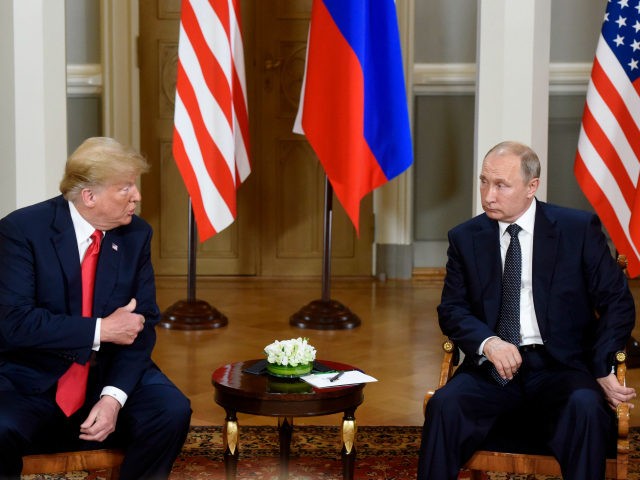 U.S. President Donald Trump, left and Russian President Vladimir Putin talk during their m