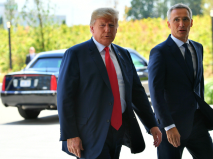 US President Donald Trump (L) is welcomed by NATO Secretary General Jens Stoltenberg as he arrives to attend the NATO (North Atlantic Treaty Organization) summit, in Brussels, on July 11, 2018. (Photo by EMMANUEL DUNAND / AFP) (Photo credit should read EMMANUEL DUNAND/AFP/Getty Images)