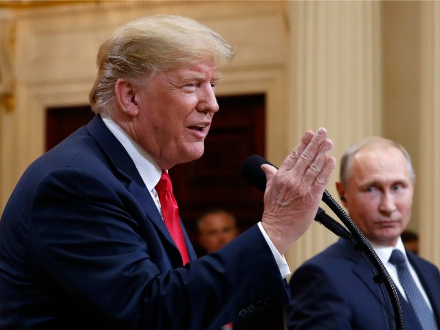 U.S. President Donald Trump speaks with Russian President Vladimir Putin during a press co