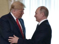 US President Donald Trump (C) shakes hands with Russia's President Vladimir Putin next to US First Lady Melania Trump (L) ahead a meeting in Helsinki, on July 16, 2018. - The US and Russian leaders opened an historic summit in Helsinki, with Donald Trump promising an 'extraordinary relationship' and Vladimir …