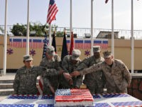 U.S.-soldiers-4th-July-cake-Afghanistan-getty US soldiers cut a cake in celebration of the 4th of July, the US Independence Day, on July 4, 2009. US President Barack Obama has made Afghanistan the centre-piece of his foreign policy, dispatching an extra 21,000 American troops as part of a sweeping new war plan to stabilise the …