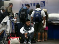 United-Airlines-passengers-getty United Airlines passengers wait in line to check in for flights at San Francisco International Airport on July 8, 2015 in San Francisco, California. Thousands of United Airlines passengers around the world were grounded Wednesday due to a computer glitch. An estimated 3,500 were affected. (Photo by Justin Sullivan/Getty Images)