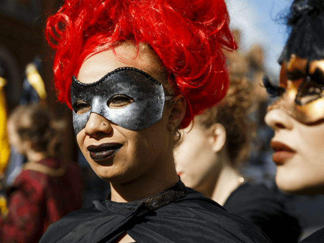 STRATFORD-UPON-AVON, ENGLAND - APRIL 23: Women dressed in mask take part in the Shakespeare Birthday Celebration Parade on April 23, 2016 in Stratford-upon-Avon, England. This year the traditional annual parade through the streets of Stratford-upon-Avon marks the 400th anniversary of Shakespeare's death. (Photo by Tristan Fewings/Getty Images)
