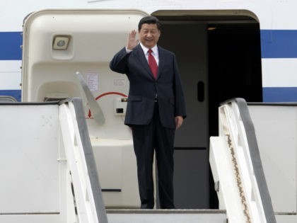Chinese President Xi Jinping alights from the plane upon arrival in Caracas on July 20, 2014. Xi departed Argentina Sunday for Venezuela, the next-to-last stop of a Latin American tour aimed at bolstering trade with the region. AFP PHOTO/LEO RAMIREZ (Photo credit should read LEO RAMIREZ/AFP/Getty Images)