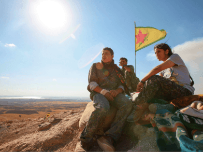 KOBANE, SYRIA - JUNE 20: (TURKEY OUT) A Kurdish People's Protection Units, or YPG fighters stand near a check point in the outskirts of the destroyed Syrian town of Kobane, also known as Ain al-Arab, Syria. June 20, 2015. Kurdish fighters with the YPG took full control of Kobane and …