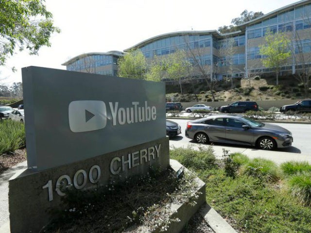 A YouTube sign is shown across the street from the company's offices in San Bruno, Calif., Tuesday, April 3, 2018. A woman opened fire at YouTube headquarters Tuesday, setting off a panic among employees and wounding several people before fatally shooting herself, police and witnesses said. (AP Photo/Jeff Chiu)