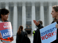 The Supreme Court Hears Hears Affirmative Action Case Regarding Admissions To Texas University WASHINGTON, DC - OCTOBER 10: Helen Tran (L) and Jennifer Hicks protest in front of the U.S. Supreme Court on October 10, 2012 in Washington, DC. Today the high court is scheduled to hear arguments on Fisher …