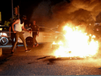 basra protest Iraqi protesters demanding services and jobs burn tires during a demonstration in Basra, 340 miles (550 kilometers) southeast of Baghdad, Iraq, Friday, July 13, 2018. (AP Photo)