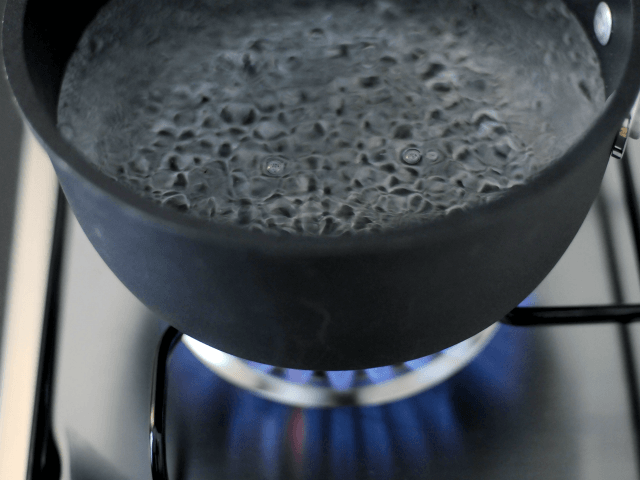 In this photo illustration water comes to the boil on a gas stove on January 8. 2009, in M