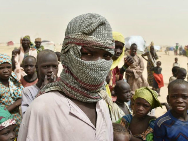 A boy looks on in a camp in the village of Kidjendi near Diffa on June 19, 2016 as displaced families fled from Boko Haram attacks in Bosso AFP/File Issouf Sanogo