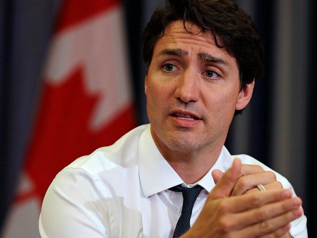 Prime Minister Justin Trudeau gestures during a roundtable discussion with members of the