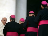 TOPSHOT - Pope Francis is greeted by bishops at the end of his general audience at St Peter's Square at the Vatican on January 31, 2018. / AFP PHOTO / FILIPPO MONTEFORTE (Photo credit should read FILIPPO MONTEFORTE/AFP/Getty Images)
