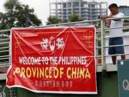 Red tarpaulin banners with the words, in English: "Welcome to the Philippines, Province of China" mysteriously appeared on footbridges across the capital, Manila, on Thursday.