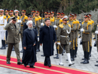 Iranian President Hassan Rouhani and Chinese President Xi Jinping (R) review troops during a welcoming ceremony on January 23, 2016 in the capital Tehran. Chinese President Xi Jinping arrived on January 22, 2016 in Iran on the third leg of a Middle East tour aimed at boosting economic ties with …
