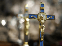 ROME, ITALY - FEBRUARY 24: Crucifixes are displayed for sale near Vatican City on February 24, 2013 in Rome, Italy. The Pontiff will hold his last weekly public audience on February 27, 2013 before he retires the following day. Pope Benedict XVI has been the leader of the Catholic Church …