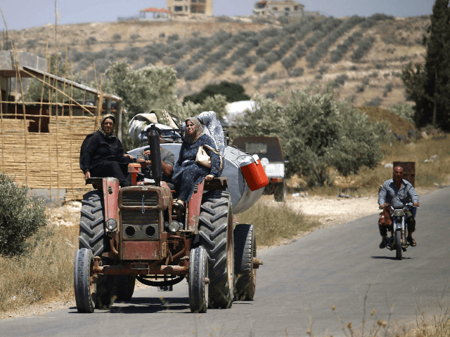 Syrians displaced by government forces' bombardment in the southern Daraa province country