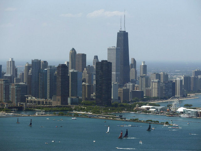 Sailboats practice in front of the downtown Chicago skyline, Friday, June 10, 2016, during