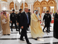 donald trump US President Donald Trump (C-L) and Saudi Arabia's King Salman bin Abdulaziz al-Saud (C-R) arrive for the Arab Islamic American Summit at the King Abdulaziz Conference Center in Riyadh on May 21, 2017. / AFP PHOTO / MANDEL NGAN (Photo credit should read MANDEL NGAN/AFP/Getty Images)