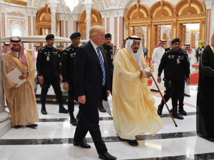 US President Donald Trump (C-L) and Saudi Arabia's King Salman bin Abdulaziz al-Saud (C-R) arrive for the Arab Islamic American Summit at the King Abdulaziz Conference Center in Riyadh on May 21, 2017. / AFP PHOTO / MANDEL NGAN (Photo credit should read MANDEL NGAN/AFP/Getty Images)