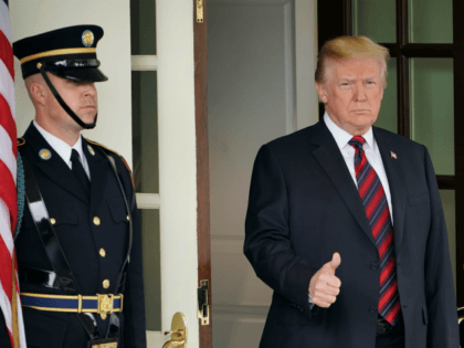 US President Donald Trump gives the thumbs-up as he awaits the arrival of South Korea's Pr