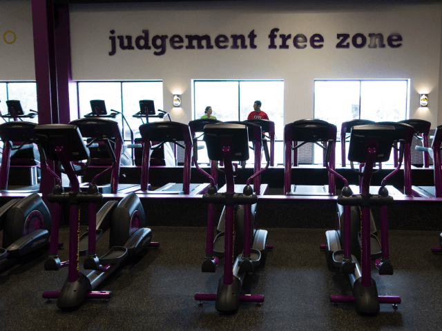 People exercise at Planet Fitness in the Columbia Mall on July 24, 2017 in Bloomsburg, Pennsylvania. Mall space is being repurposed as more department store chains close stores that have traditionally served as 'anchors' at malls. The Planet Fitness now occupies the space that was previously a Sears. The glass …
