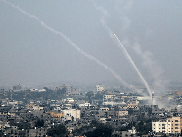 A picture taken on July 14, 2018 shows Palestinian rockets being fired from Gaza City towa