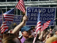 i-stand-for-religious-freedom-rally-american-flags-getty Flags and signs are held during a rally for religious freedom organized in part by the Catholic Archdiocese of Philadelphia in front of Independence Hall Friday, March 23, 2012 in Philadelphia. The rally was in objection to the Health and Human Service mandate that private health care cover women's contraception. …