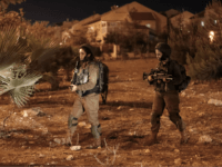 A picture taken on July 26, 2018 shows Israeli security forces at the Adam settlement in the occupied West Bank where a stabbing attack took place. - Three Israelis were wounded in a knife attack in a West Bank settlement close to Ramallah, the Israeli army said. (Photo by Ahmad …