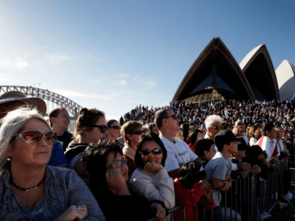 SYDNEY, AUSTRALIA - MAY 15: Large crowds line the Sydney Opera House forecourt for the arrival of teen sailor Jessica Watson following her world record attempt to become the youngest person to sail solo, non-stop and unassisted around the world, in Sydney Harbour on May 15, 2010 in Sydney, Australia. …